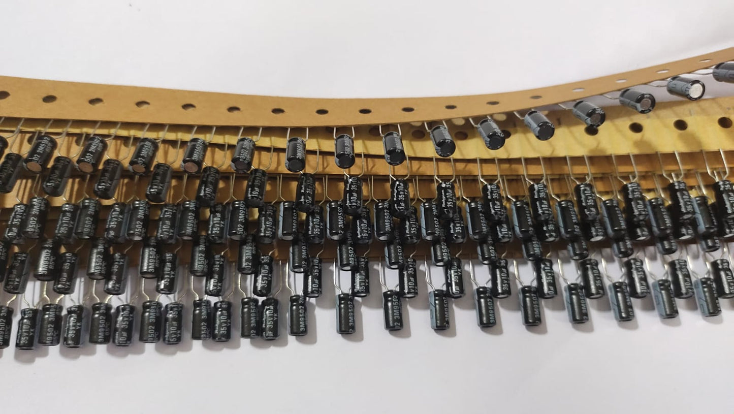 Row of black cylindrical components on a white background