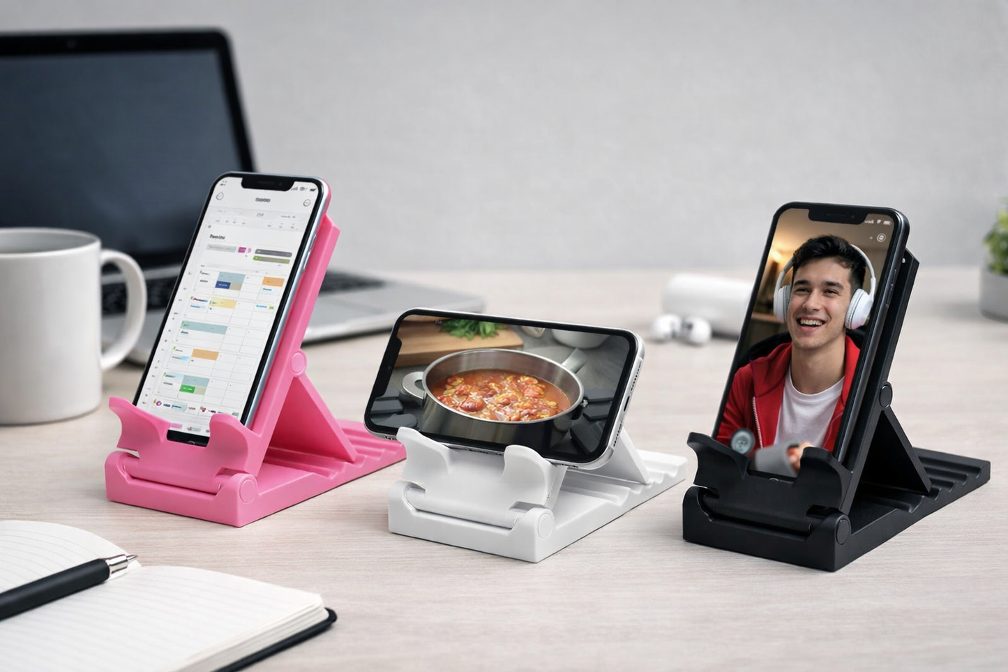 Three smartphone stands on a desk with different phone setups