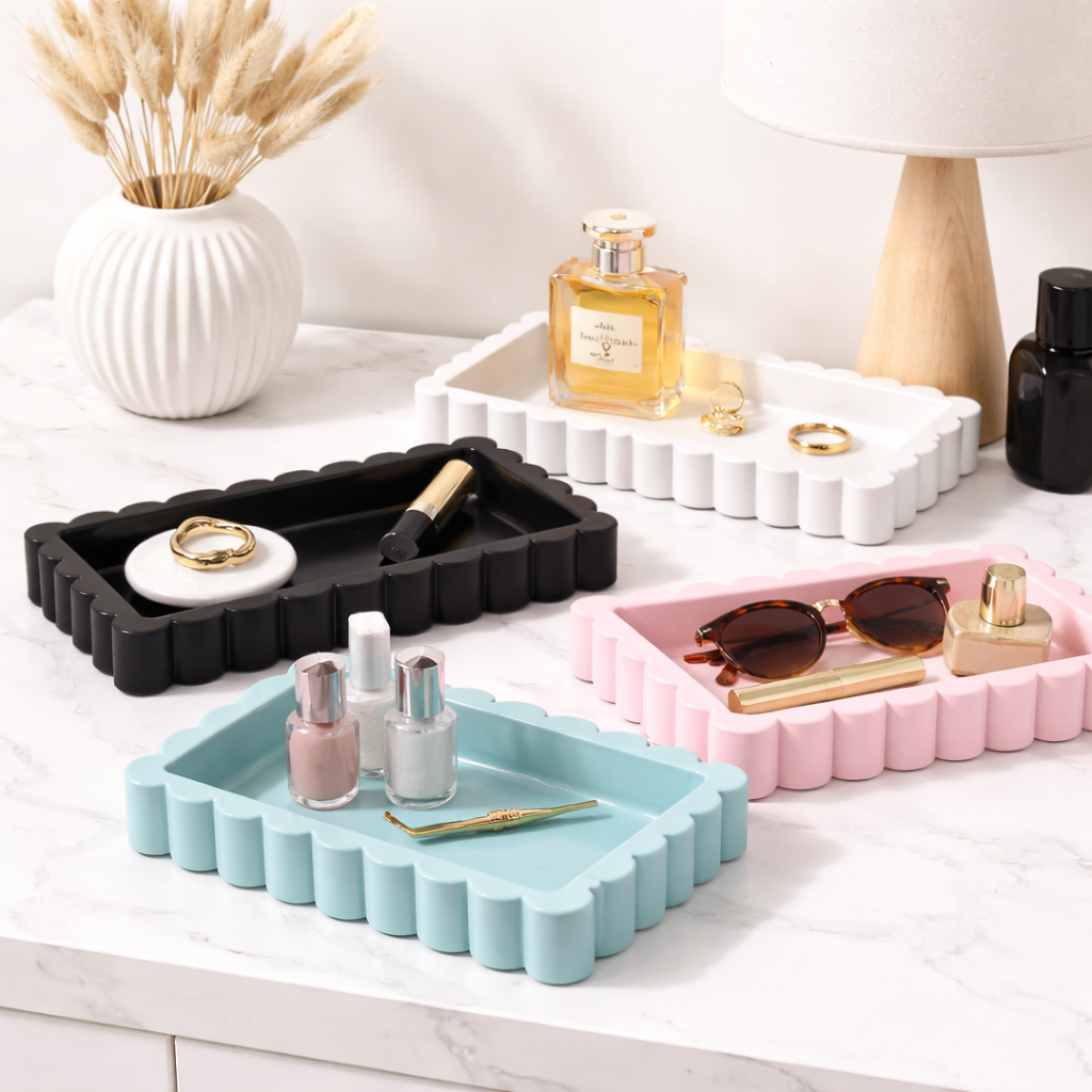 Set of colorful trays with small items on a white surface