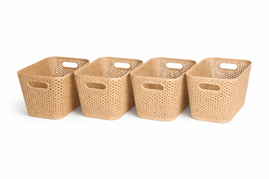 Four woven baskets of varying sizes on a white background