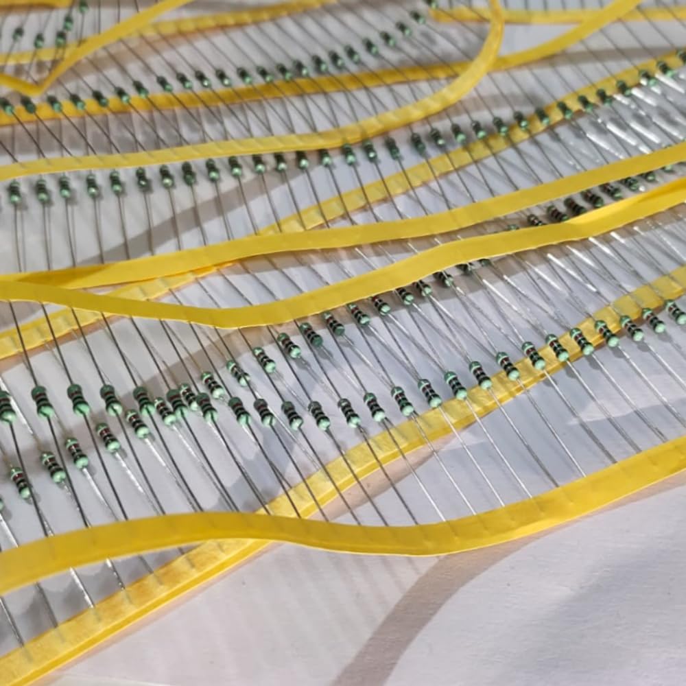 Close-up of resistors on a yellow ribbon cable
