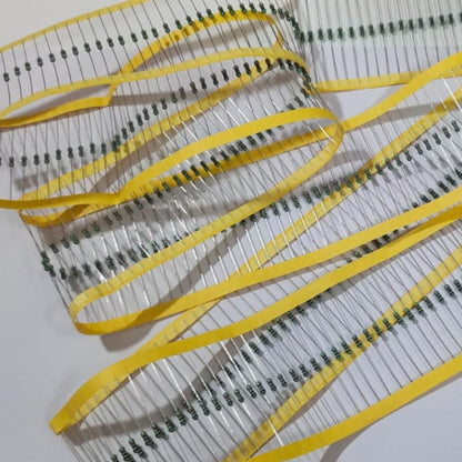 Close-up of resistors with yellow bands on a white background