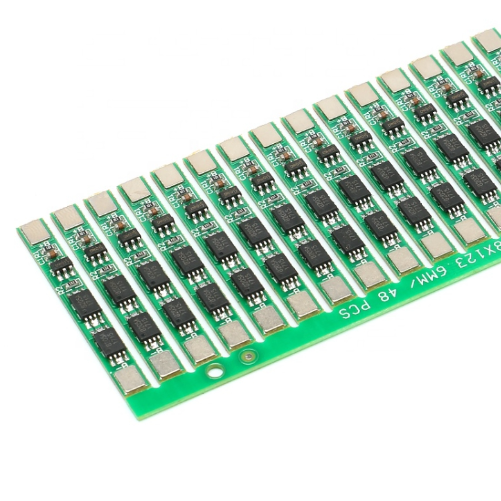 Row of electronic components on a green printed circuit board with a white background
