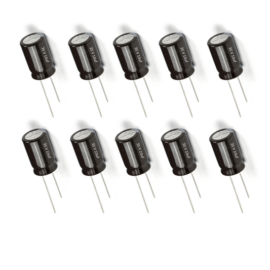 Row of black electrolytic capacitors on a white background