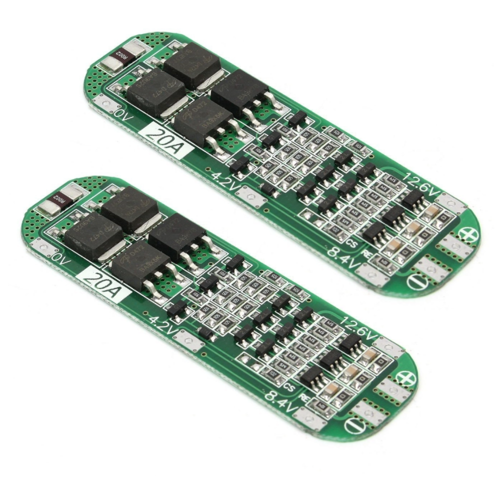 Two green electronic circuit boards with components on a white background