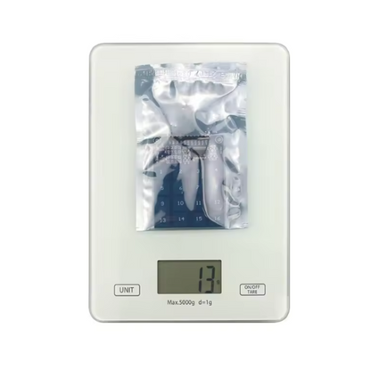 Digital kitchen scale with a clear cover on a white background