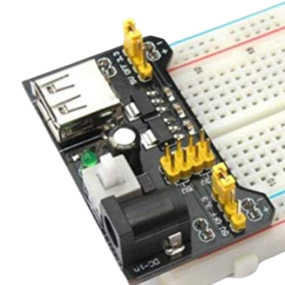 Electronic component board with USB connector and breadboard on a white background
