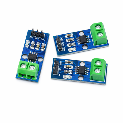 Three electronic modules with blue and green connectors on a white background