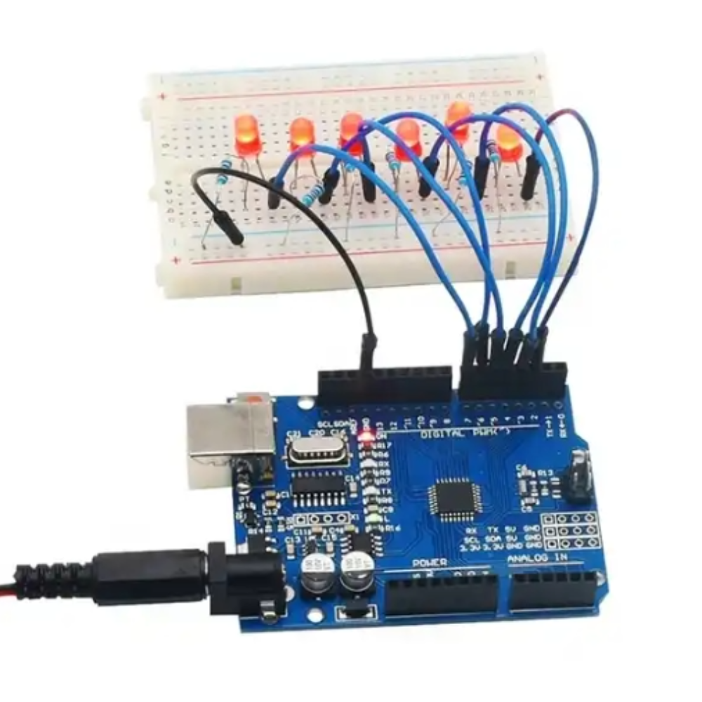 Arduino board with wiring and breadboard on a white background