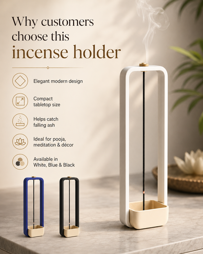 A tall rectangular incense holder with a square base, shown in white with a beige base and a smoking incense stick inserted. The image includes marketing text on the left and two smaller incense holders in blue and black on a marble surface, with a softly blurred plant and decorative bowl in the background.