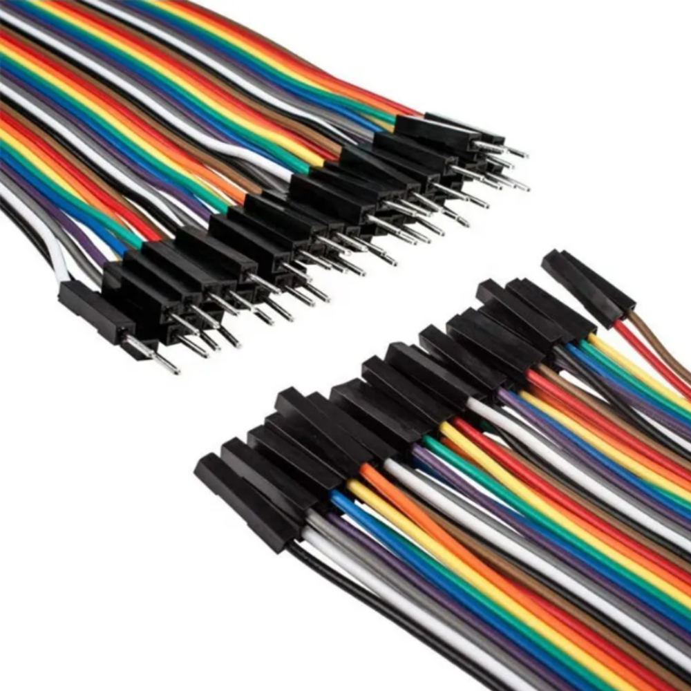 Set of multicolored wires with black connectors on a white background