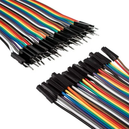 Set of multicolored wires with black connectors on a white background