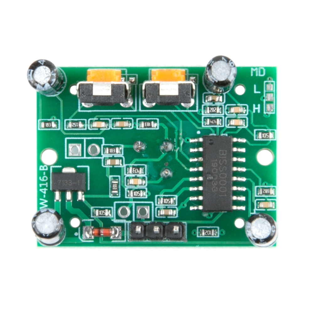 Green electronic circuit board with various components on a white background