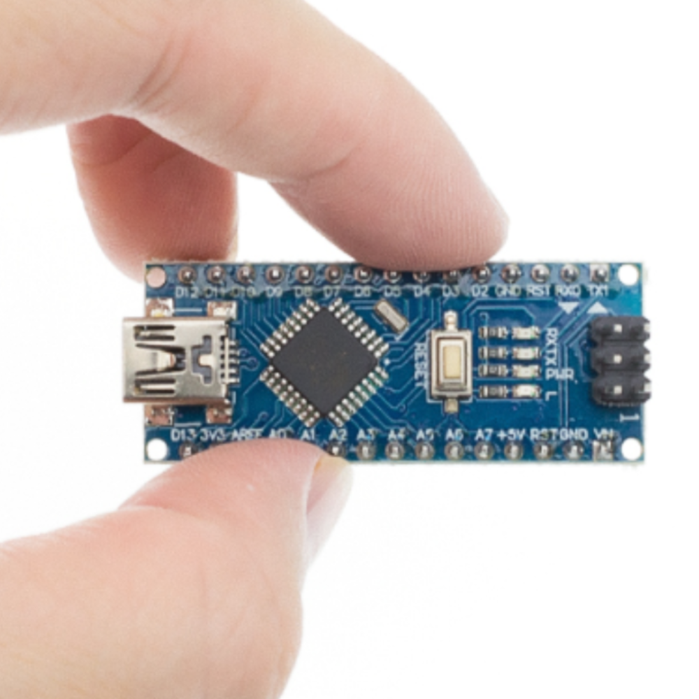 Hand holding a blue Arduino Nano–compatible microcontroller board to show size and detail