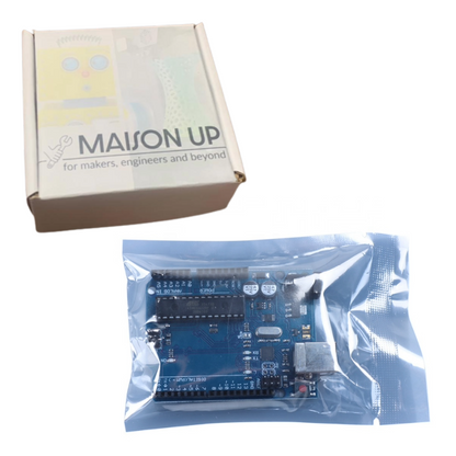 Electronic board in clear packaging with 'MAISON UP' branded box on a white background