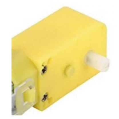 Yellow plastic component with white screws on a white background
