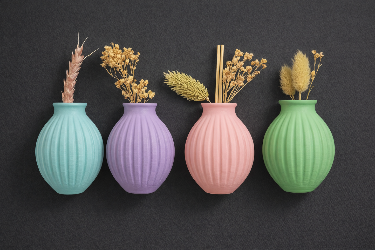 Four colorful vases with ribbed texture on a dark background