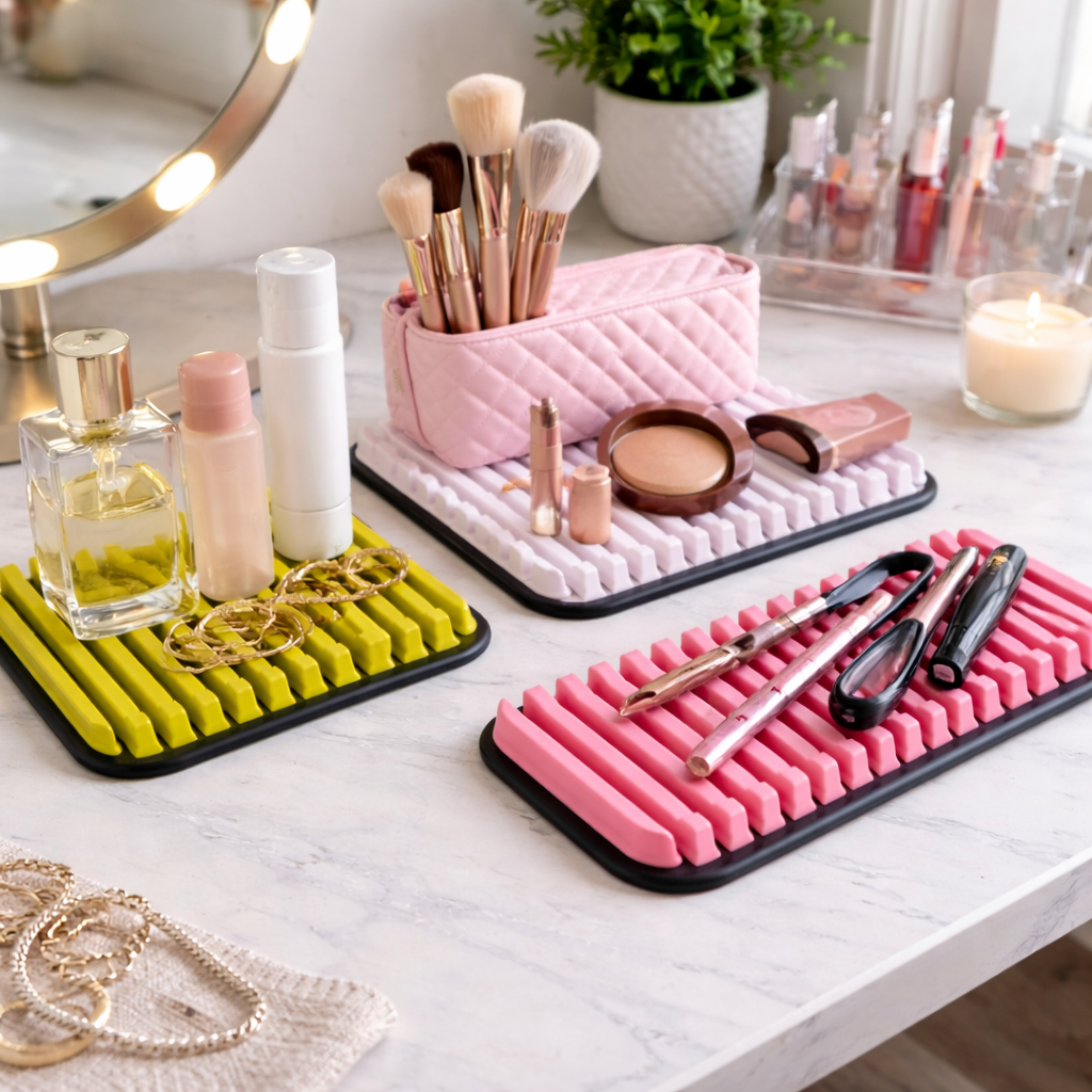 Pink silicone mat with makeup tools on a vanity table