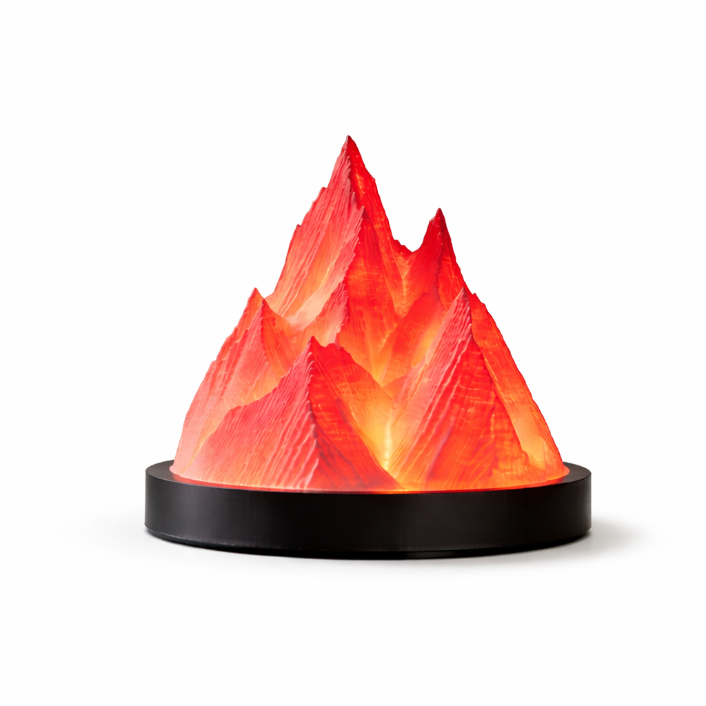 Mountain-shaped lamp with a glowing red interior on a white background
