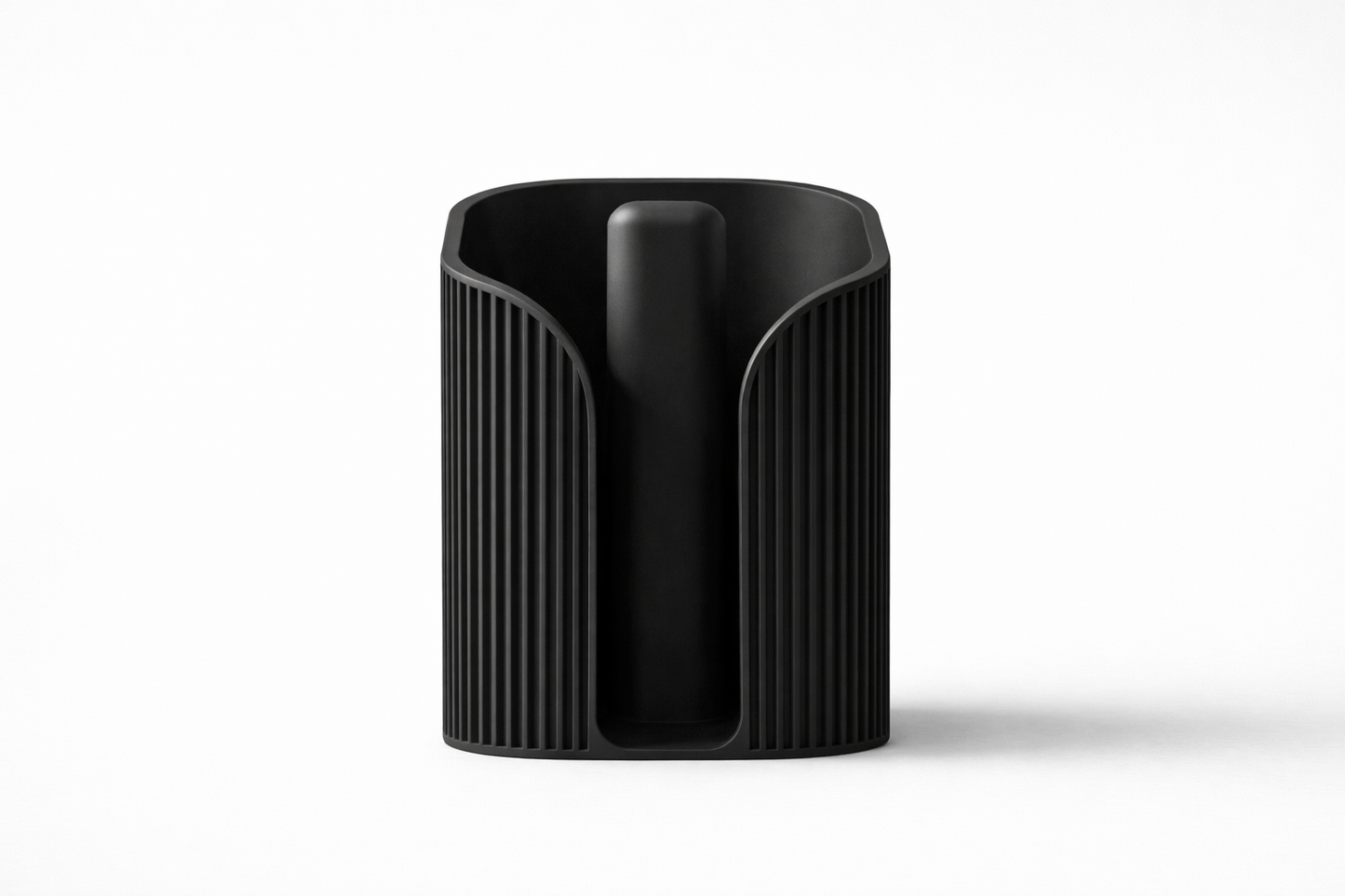 Black cylindrical container with textured surface on a white background
