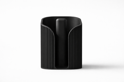 Black cylindrical container with textured surface on a white background
