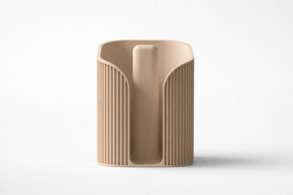 Beige ceramic vase with textured design on a white background