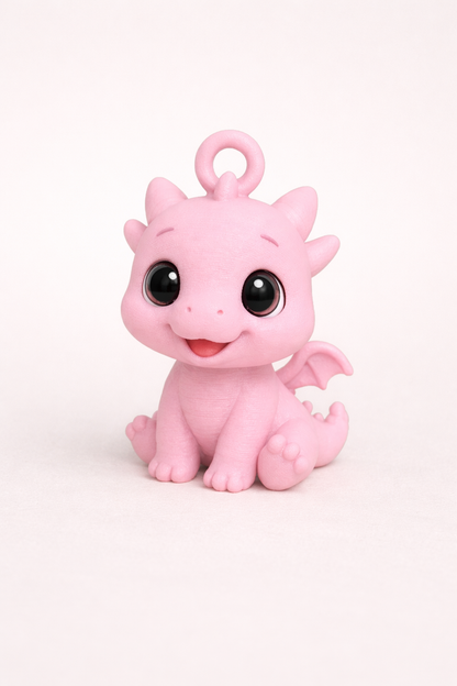 Pink dragon-shaped toy on a white background
