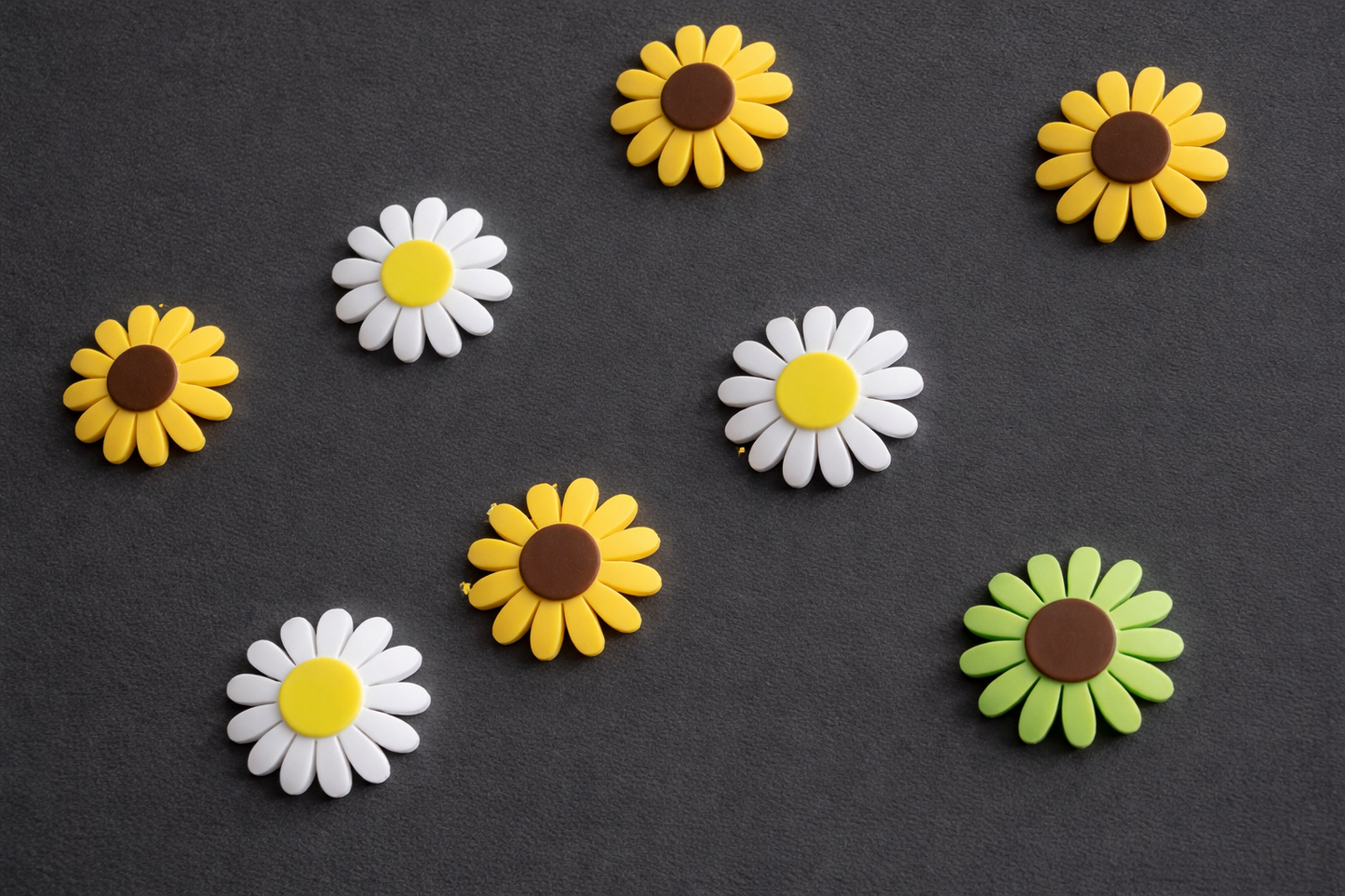 Decorative sunflower-shaped candies on a dark background