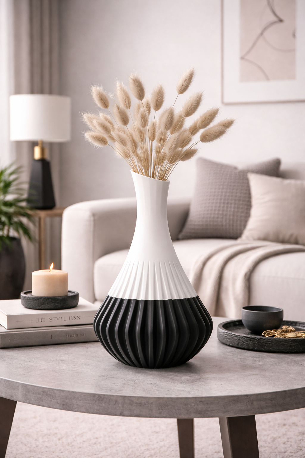 Decorative vase with dried plants on a coffee table in a living room setting