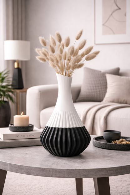 Decorative vase with dried plants on a coffee table in a living room setting