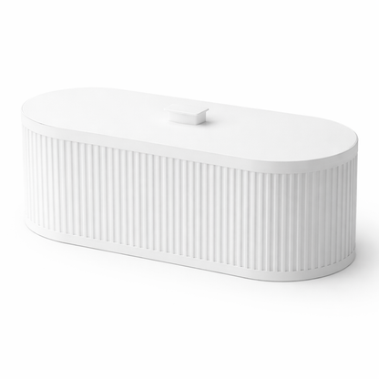 White ceramic bathtub with ribbed texture on a white background