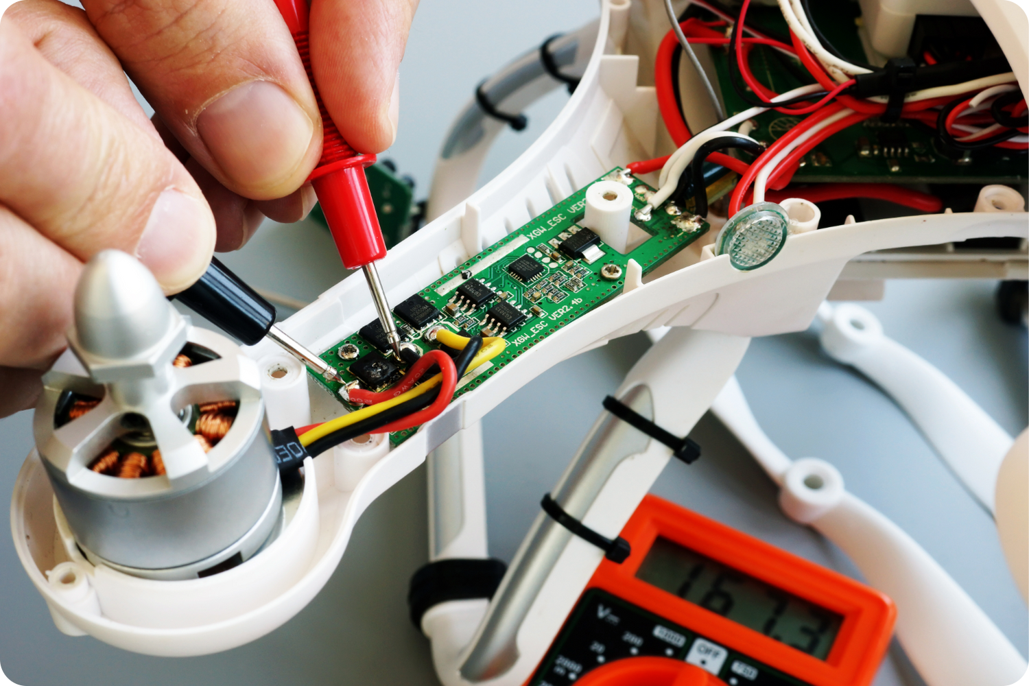 Electronic components collection with microcontrollers, sensors, breadboard, jumper wires, relay module, LCD display, LEDs and resistors