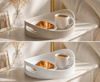 A white ribbed ceramic breakfast tray with a handle, styled on a white bedside table with a croissant and a white coffee mug. The top half includes a decorative framed picture and a glass vase with dried stems, while the bottom half is a duplicate of the scene without these props.