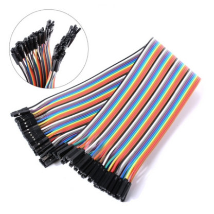 Set of multicolored wires with black connectors on a white background