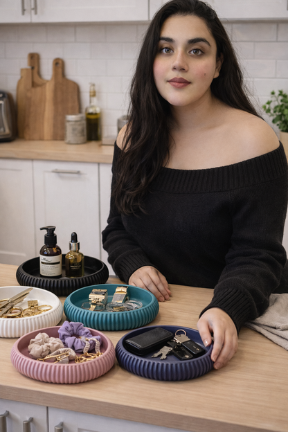 Woman in a kitchen with decorative bowls on a counter