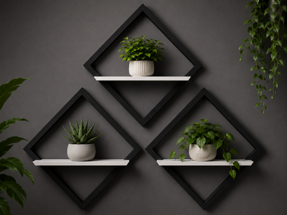 Black geometric wall shelves with white shelves holding potted plants against a dark gray wall.