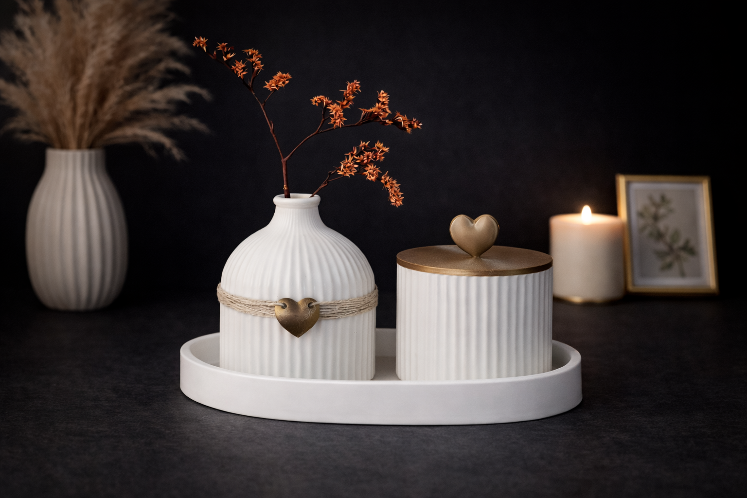 Decorative setting with white vases and containers on a dark background