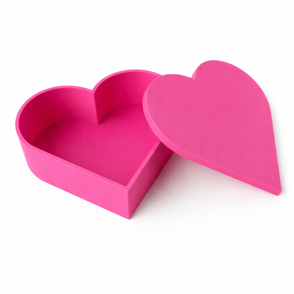 Pink heart-shaped box on a white background