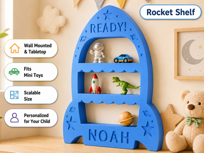 A blue rocket-shaped children's shelf with three open tiers, shown in a styled nursery setting. The shelf is personalized with the name 'NOAH' at the bottom and has toy examples displayed on its shelves.