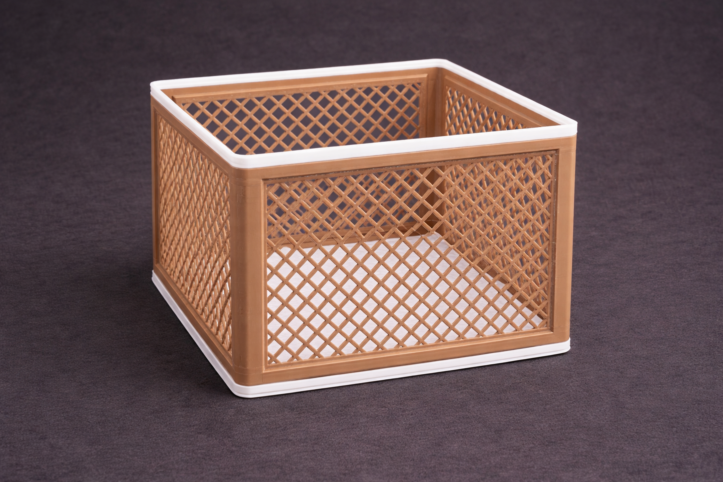 Woven basket with lattice design on a dark background