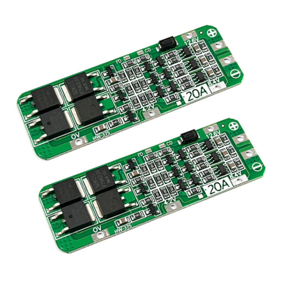 Two green electronic circuit boards with components on a white background