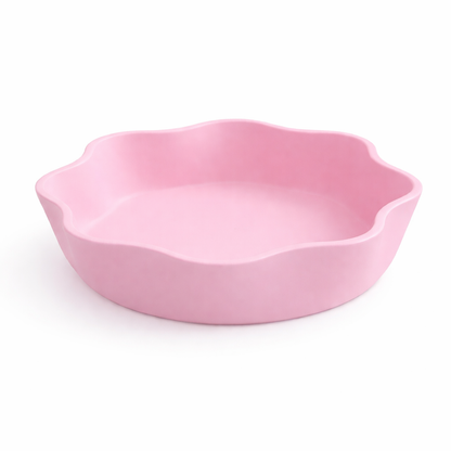 Pink ceramic dish on a white background