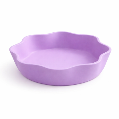 Purple ceramic dish on a white background