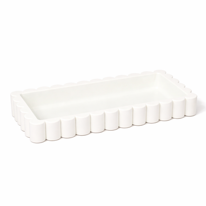 White scalloped-edge rectangular tray on a white background