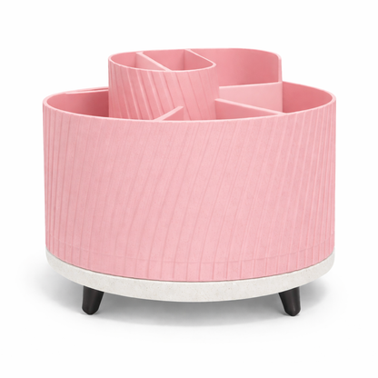 Pink cylindrical organizer with multiple compartments on a white background