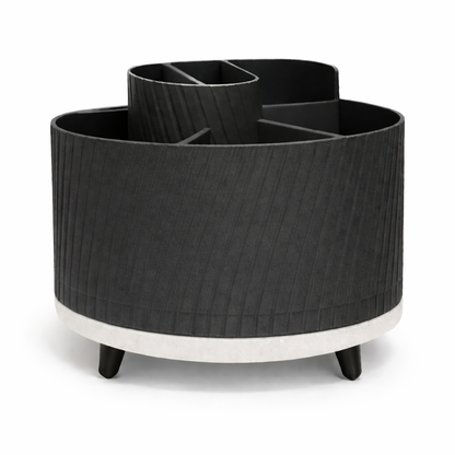 Black cylindrical planter with white base on a white background