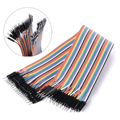 Set of multicolored wires with black connectors on a white background