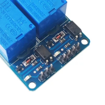 Blue electronic relay module on a white background