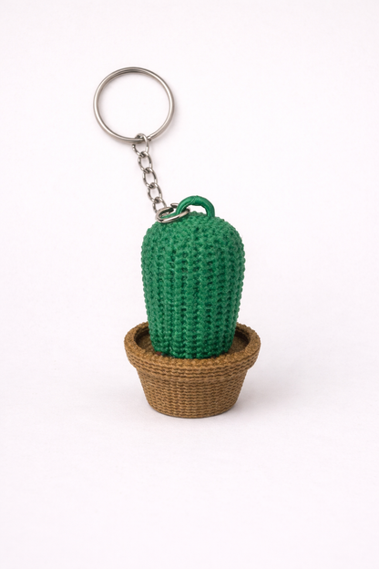 Crocheted cactus keychain in a pot on a white background