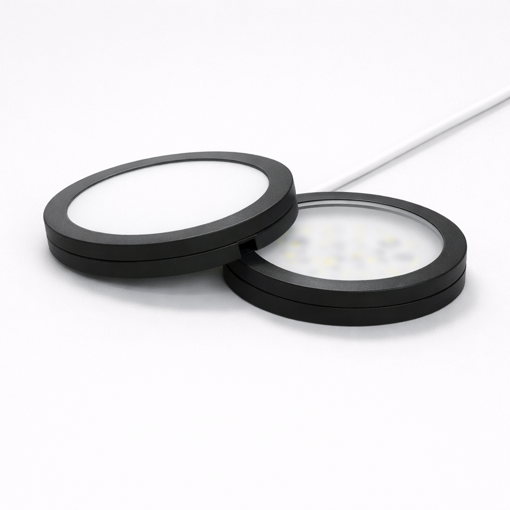 Two circular black filters on a white background